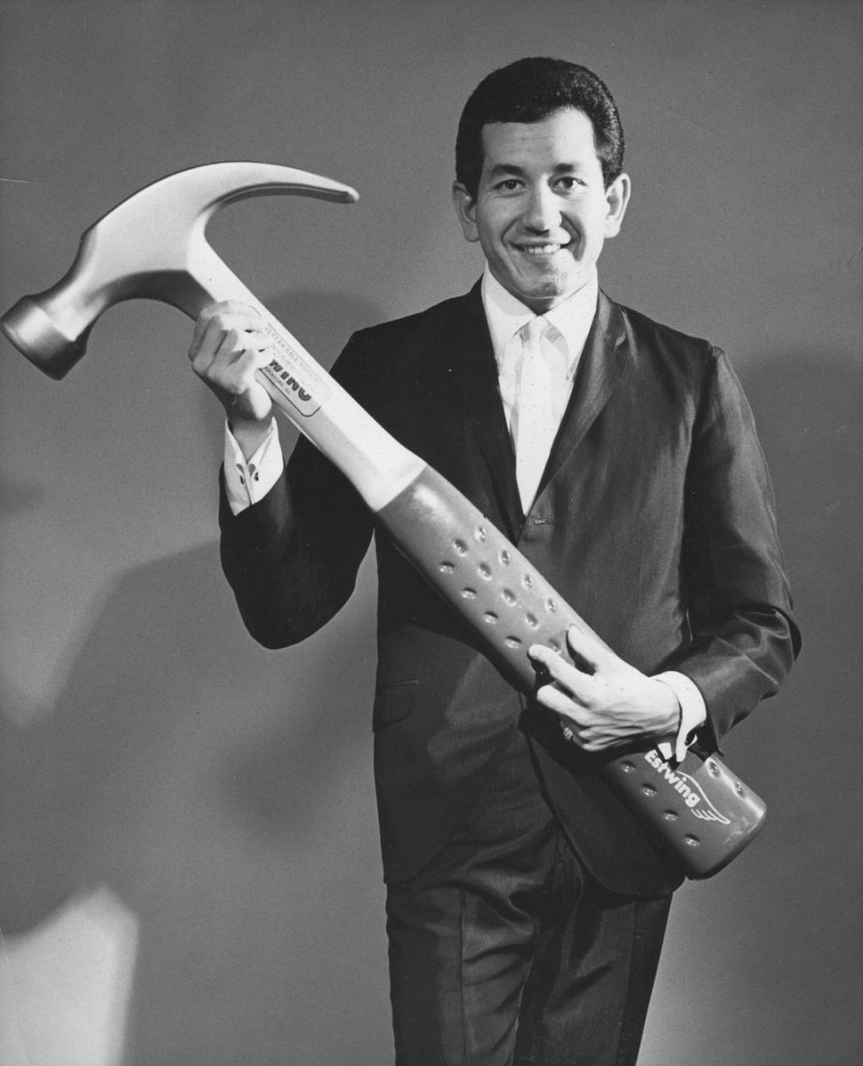 Trini Lopez holding a hammer for his song I Had A Hammer