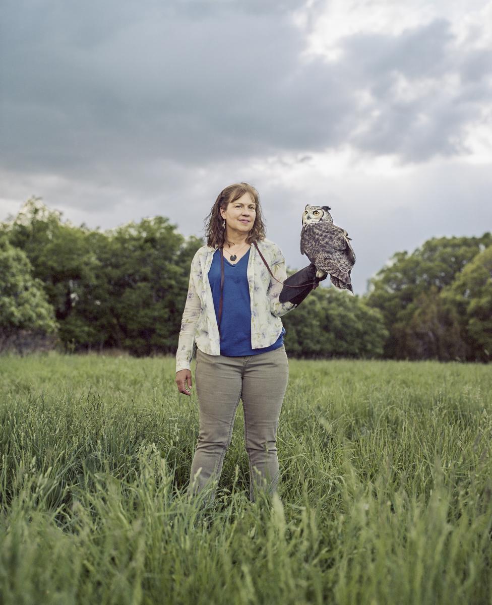 Volunteer holding owl at the Santa Fe Raptor Center