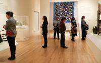 People viewing a quilt at the Georgia Museum of Art