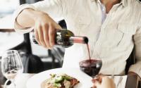 Dining - man pouring wine