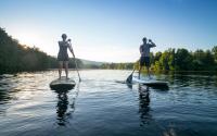 Couple paddle boarding on Beaver Creek