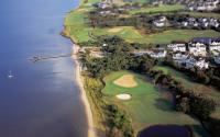 Aerial view of a golf course along the coast in the Outer Banks
