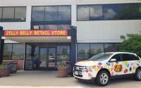 Jelly Belly bean car at entrance with store sign