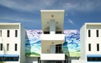 Photo of Public Artwork, colorful wave mural on the front of the Amman Building.