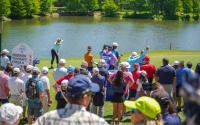 Spectators watching golfers during The Chevron Championship in The Woodlands, Texas