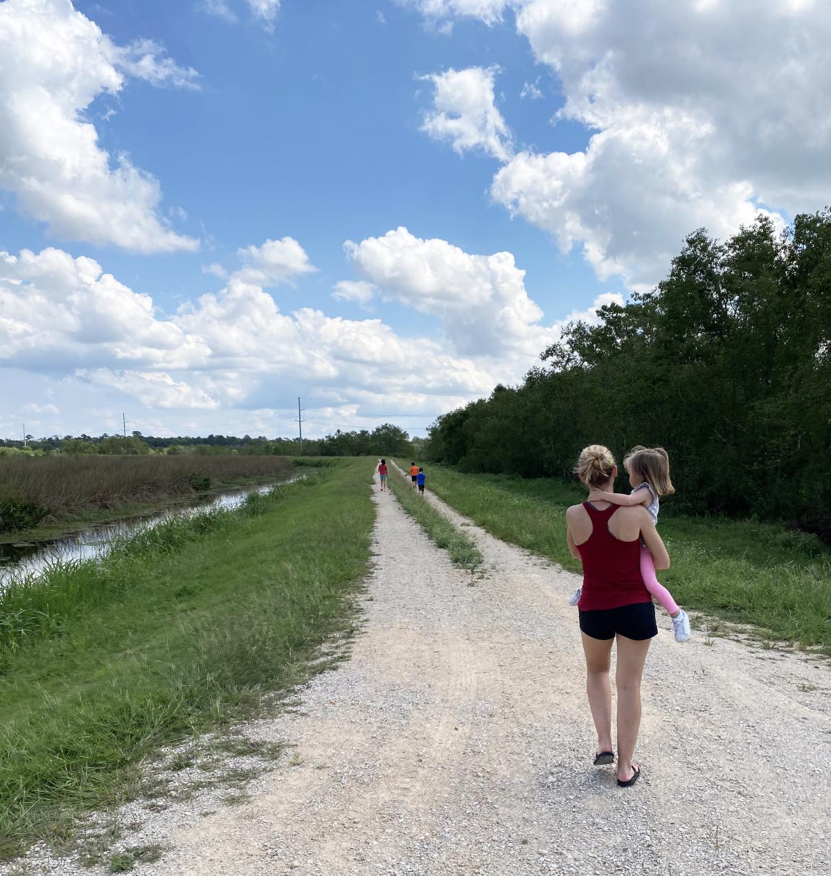 Woman and children in Cattail Marsh in Beaumont, TX