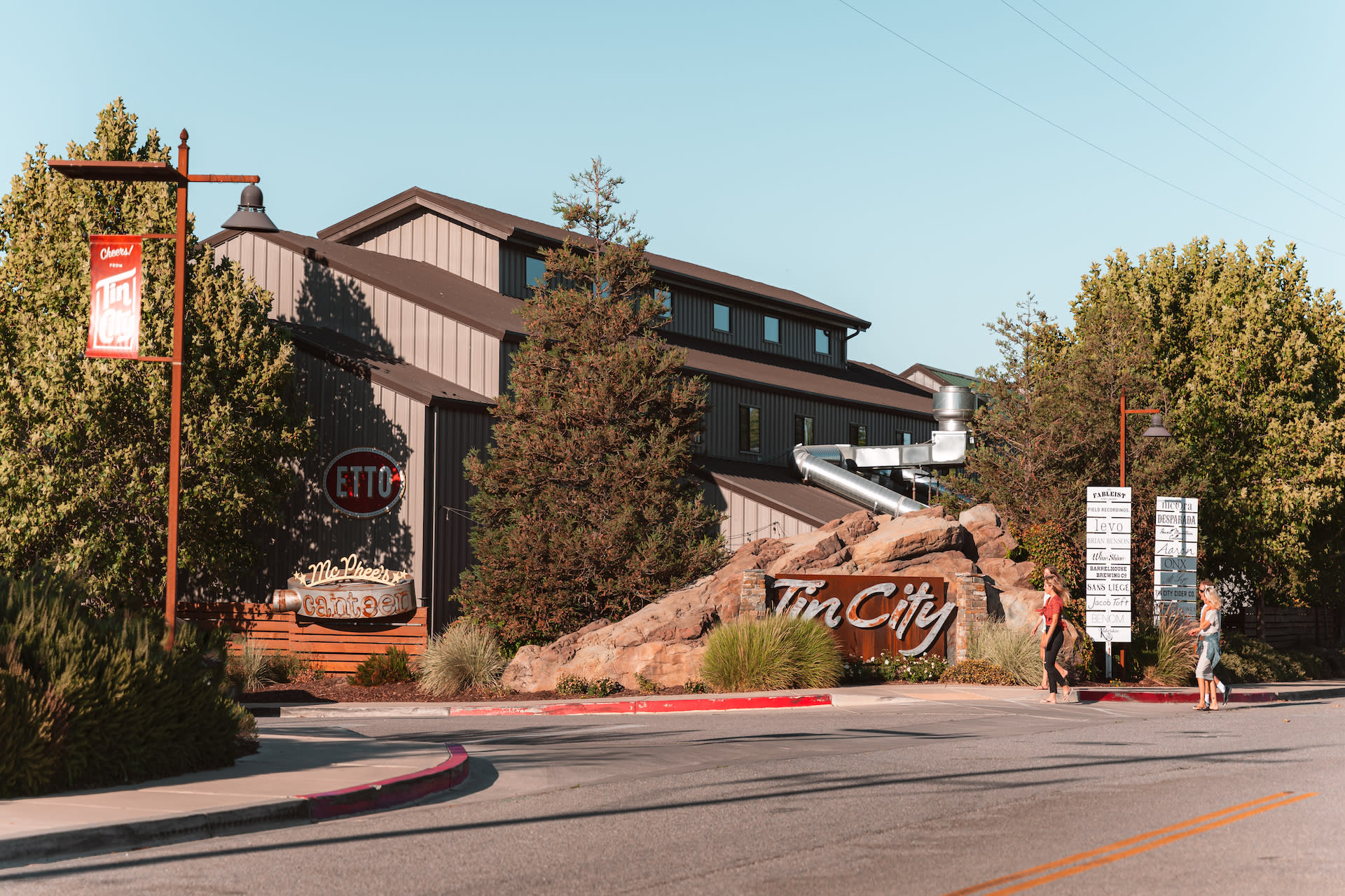 Tin City Paso Robles Entrance showing a group of people walking in