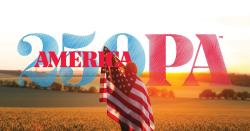 Picture of the America 250 PA Logo layered over a picture of the sun setting over a pretty landscape with flowing fields and a girl in the middle of the field wrapped up in an American Flag.