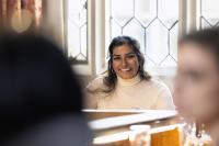 Asian woman smiling in a meeting