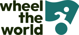 Wheel the World Logo in bold black print with outline of a wheel chair user to the right side of the text.