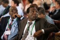 ISTA 2024 Cambridge Conference Afro Caribbean man looking over left shoulder with others in the background