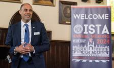 ISTA 2024 Cambridge conference man speaker smiling towards audience