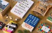 Assortment of books and games from Columbus businesses