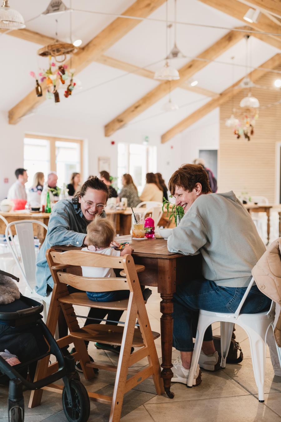 Roots and Seeds cafe Grandmother, daughter and grandchild around one table
