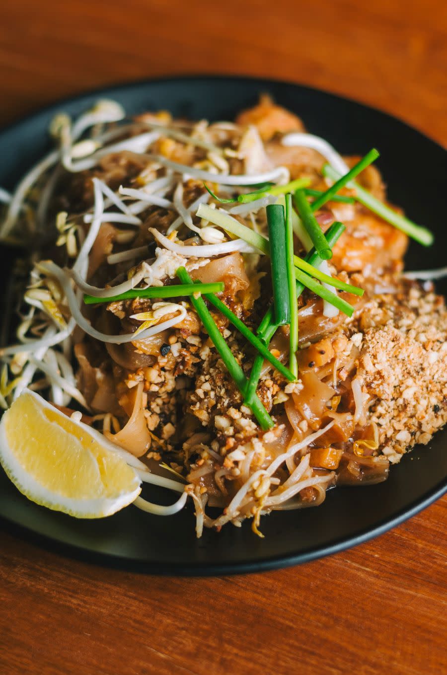 Authentic pad thai on a black plate at a Provo Center Street restaurant