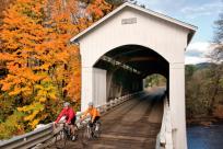 Mosby Covered Bridge Cycling in Fall by David Bassett
