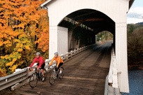 Cycling Mosby Covered Bridge in Cottage Grove by David Bassett