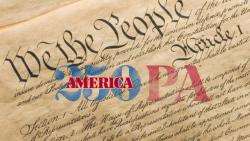 Picture of the America 250 PA Logo layered over a picture of the Preamble to the United States Constitution. You can see three big words at the start of the page saying "we the people..."