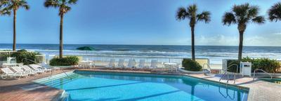 An inviting pool is a serene scene at a Daytona Beach oceanfront hotel