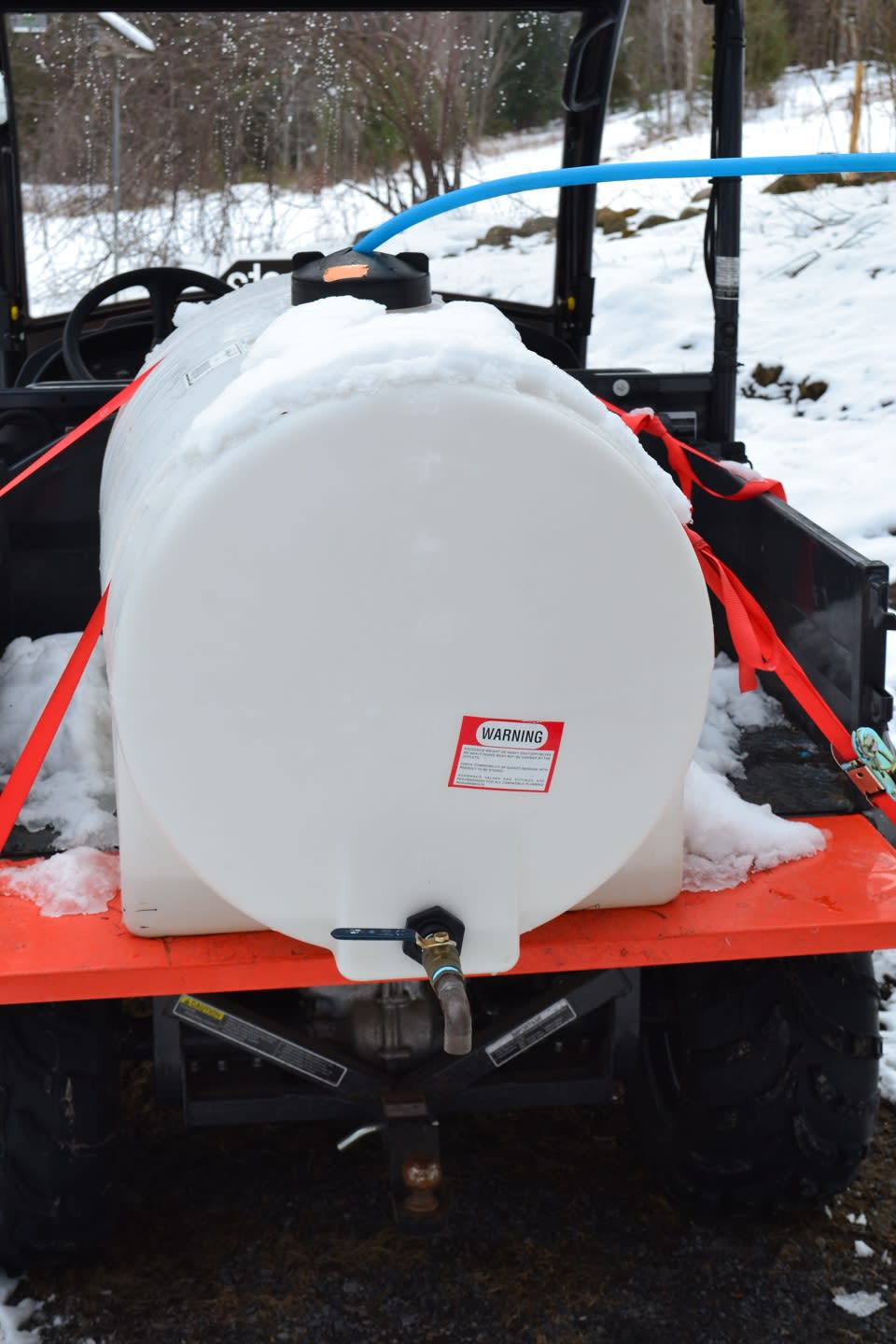 maple sap holding tank on a four wheeler ATV at Up Yonda Farm