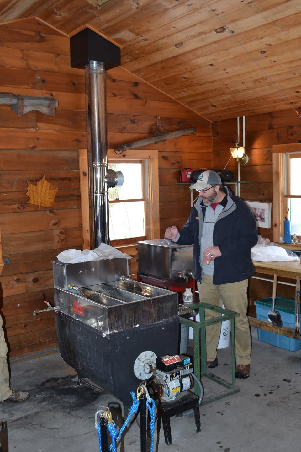 Peter Olesheski by the maple sap boiler in the sugar shack at Up Yonda Farm