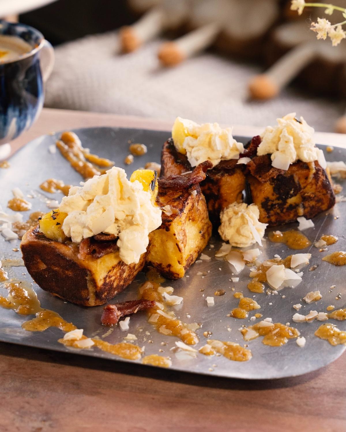 A close-up shot of the Hawaiian French Toast from Curious Toast Cafe.