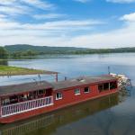 Picture of the Millersburg Ferry on the River with blue sky and mountains in the background