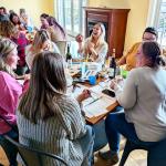 Picture of a group of people at a painting class with Rise and Design Art Studio