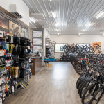 Picture of the sales shop at Brookside Bikes in Mifflinburg. You can see a row of bikes as well as a wall of bike parts and accessories.