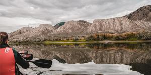 A canoe paddling down the river.