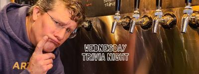 man with thoughtful face next to beer taps