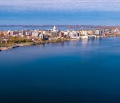 An aerial photo of the Madison skyline from Lake Monona