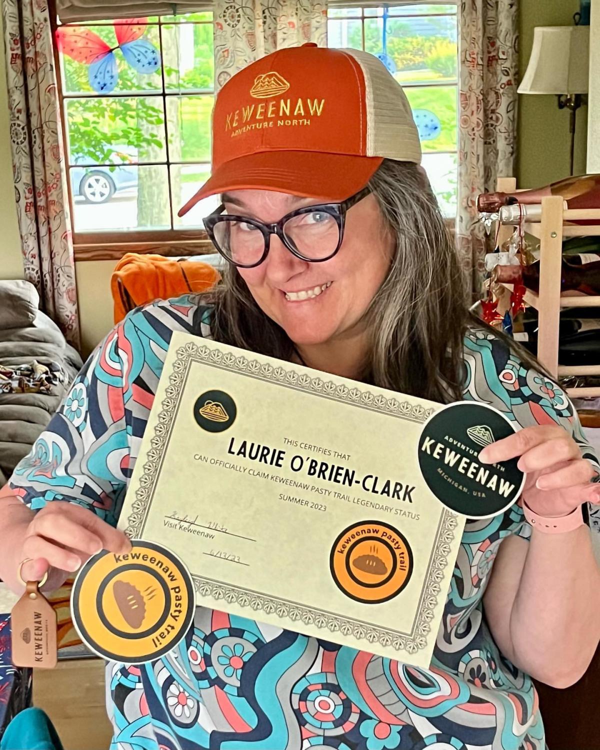 Laurie O' Brien-Clark poses with Pasty Trail swag.