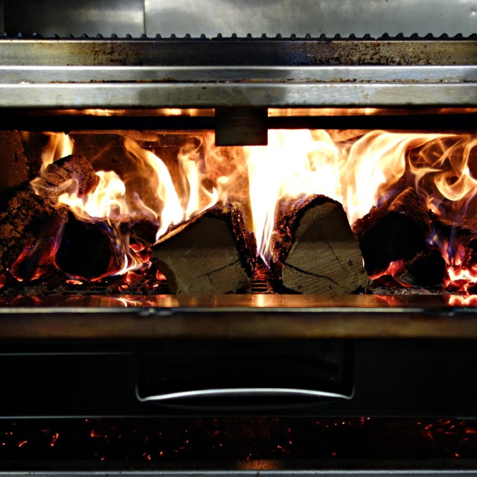 All steaks are cooked on a wood-fired grill.