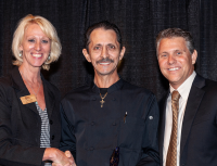 Restaurant Back of House Hero Juan Cazares accepts his award from FRLA's Lois Croft and the VCB's Sean Doherty