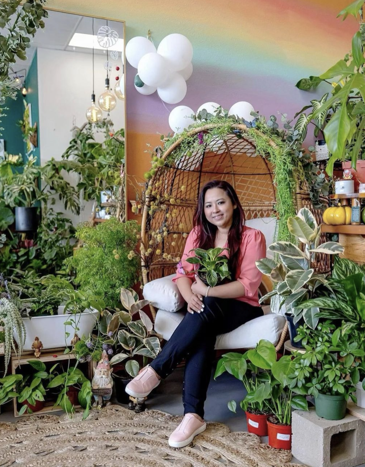 House Plant Nation. Tammy Ha the owner surrounded by plants