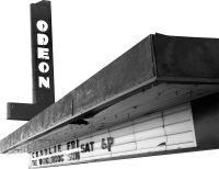 Black and white image of an old Odeon theater sign with marquee letters.
