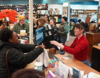 Picture of person purchasing books at the front counter of Otto Bookstore