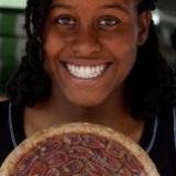 Girl with smile holding pie