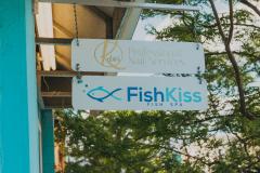 Fish Kiss Sign and Front of Building