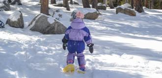 Small child Snowshoeing