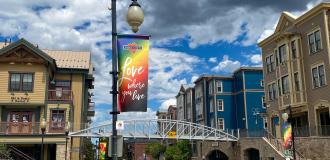 Rainbow sign that reads Love where you live
