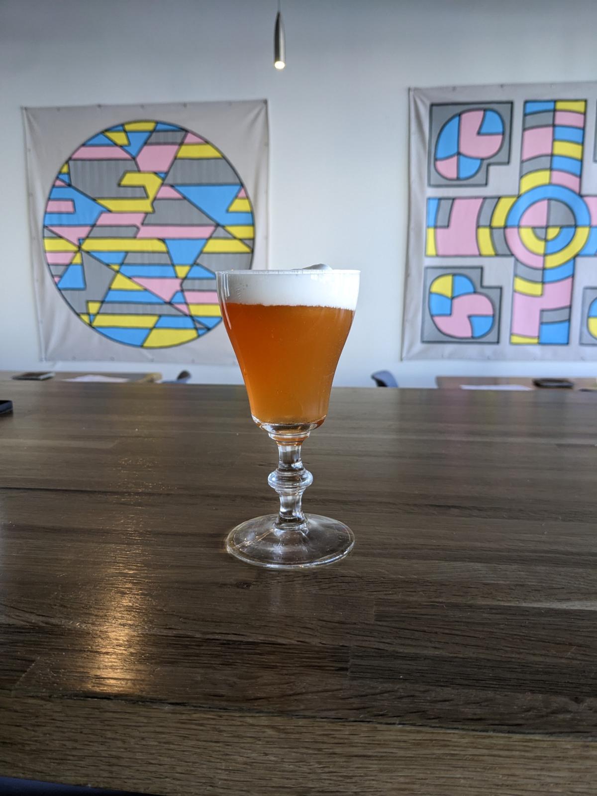 A hojicha pie drink from Lost Cultures Tea Bar sits on the bar.