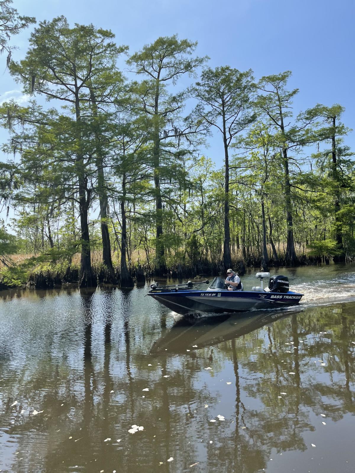 Man on speedboat in swamp in Beaumont, TX