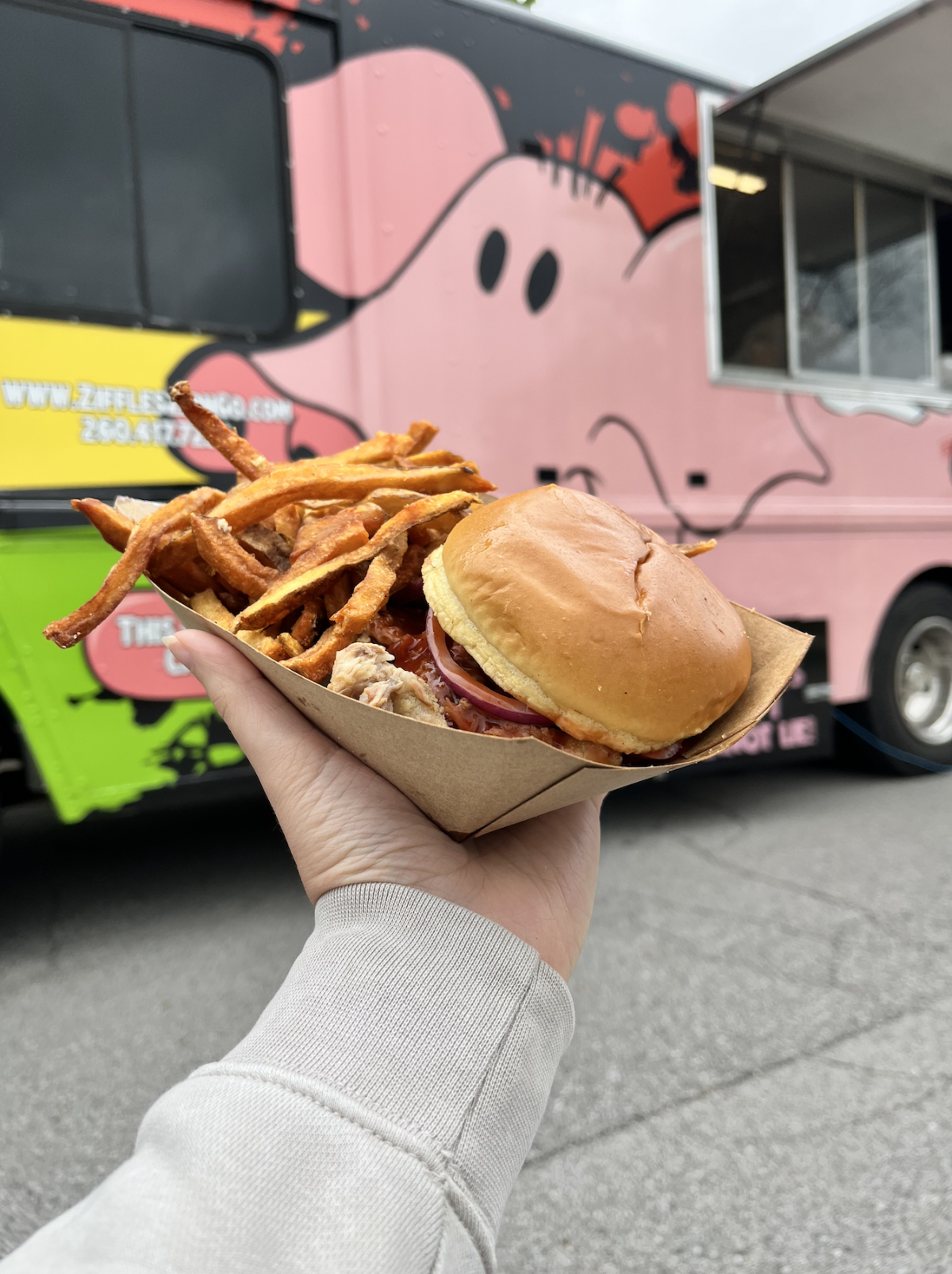 Ziffles zip n' go food truck with a pulled pork sandwich