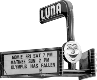 Vintage movie theater sign with "LUNA" at the top and a smiling moon face.