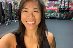 Women taking a selfie in the gym smiling.