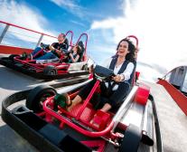 An hispanic family walking in a theme park.