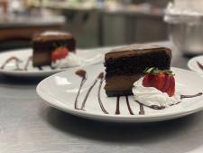 picture of Chocolate Cake with whip cream and strawberries at Banty Rooster