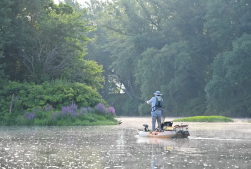 Kayak Fisherman on a creek.